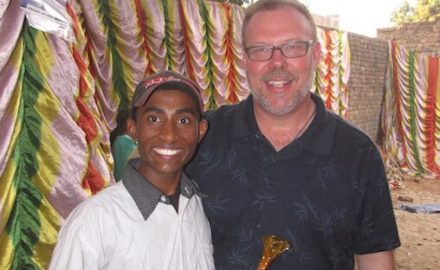 Dr. Greene in India with a local resident. He traveled there with Vitamin Angels.