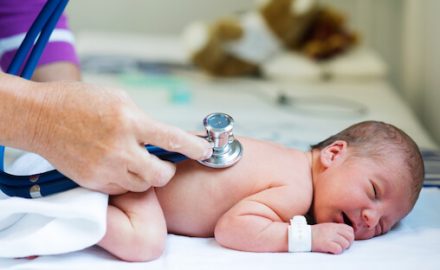 Doctor examining a young baby for Anal Stenosis.