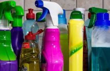 Colorful plastic bottles of cleaning supplies. Many conventional cleaning supplies are toxic.