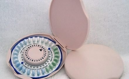 Pink pill box with birth control pills. Illustrating birth control pills and breast cancer.