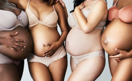 Four pregnant women of different skin colors. Chemical and pregnant women.