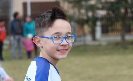 Boy with glasses, the most common treatment for Convergent Strabismus