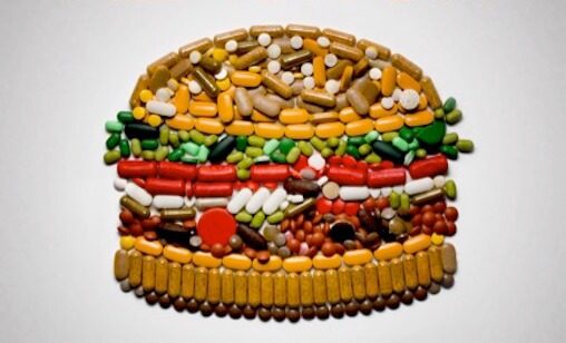 Mosaic of a hamburger using only pills to illustrate the antibiotic scorecard.