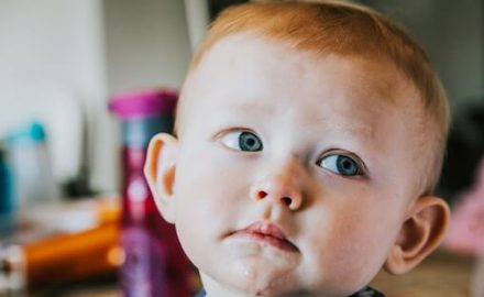 Toddler with big ears, sad face and drool. Does he need Garlic Oil for Ear Infections?