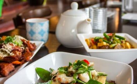 Good nutrition is vital to health. Image of bowls of fresh whole foods and a pot of tea.