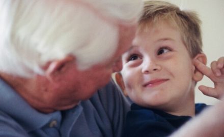 Older man with a young child. Helping children deal with grief.