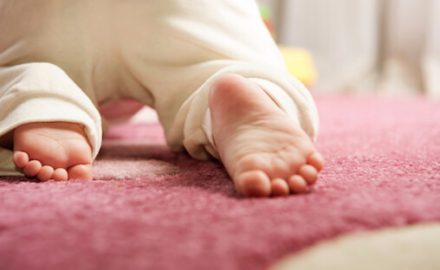Baby feet, crawling on carpet to show Moving on their Own.