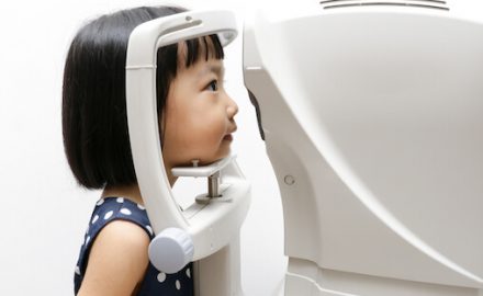 Young Asian girl having an eye health exam. This is one of the tests used to diagnose Neurofibromatosis.