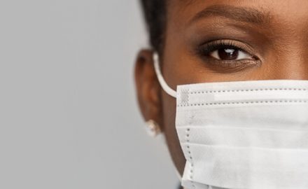 African American woman wearing a medical mask. If you must reuse a mask, here are Dr. Greene's tips to reuse masks safely.