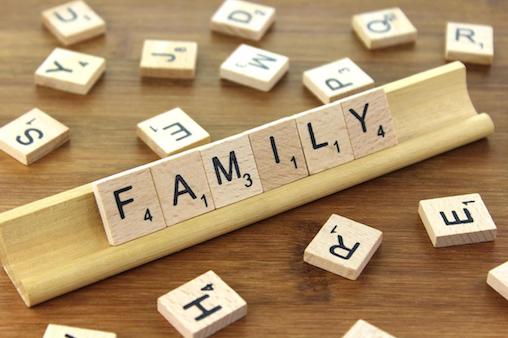 Scrabble Tiles spelling out the word family for famliy games.