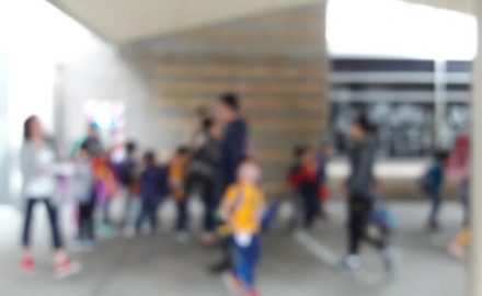 Blurry school setting with kids running in multiple directions. This is likely how Attention Deficit Hyperactivity Disorder (ADHD) feels to a kid.