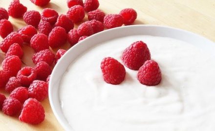 Bowl of yogurt with berries. Is yogurt good for yeast infections?